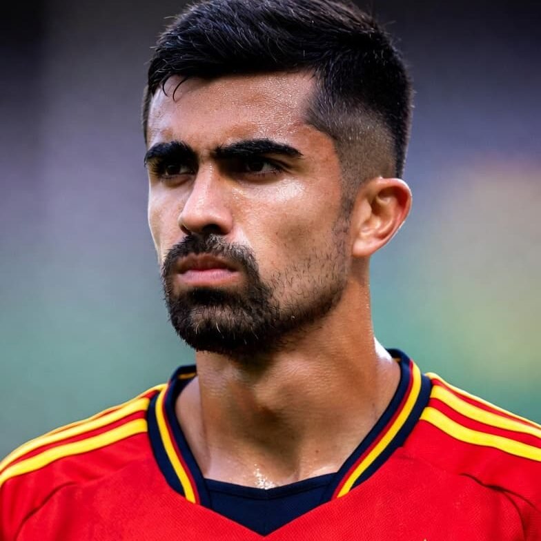 Rodri of Spain national team passing the ball in midfield during an international football match.