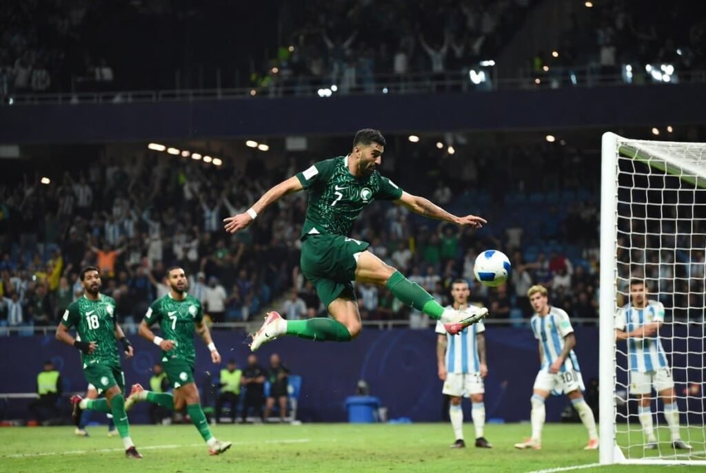 Saudi Arabia player scores against Argentina during the historic FIFA World Cup match, a moment that inspired Saudi Arabia's ambitions for the 2026 World Cup.