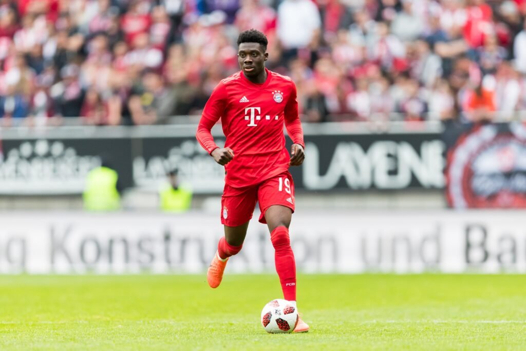 Alphonso Davies leads Canada during an international match.