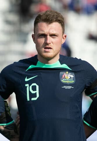 Harry Souttar wins an aerial duel for Australia.