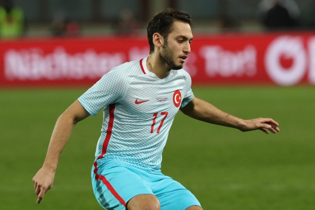 Hakan Çalhanoğlu celebrates during an international match.