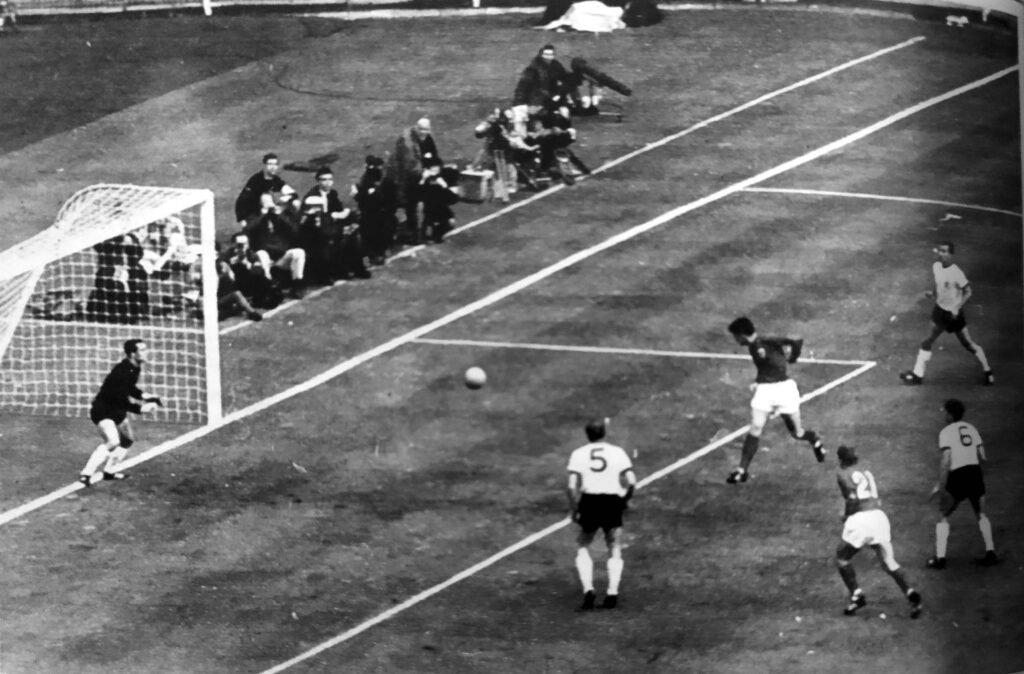 England World Cup History 1966_England Player kick the football toward the football net.