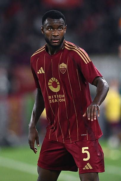 Evan Ndicka defending during an international football match for Ivory Coast.