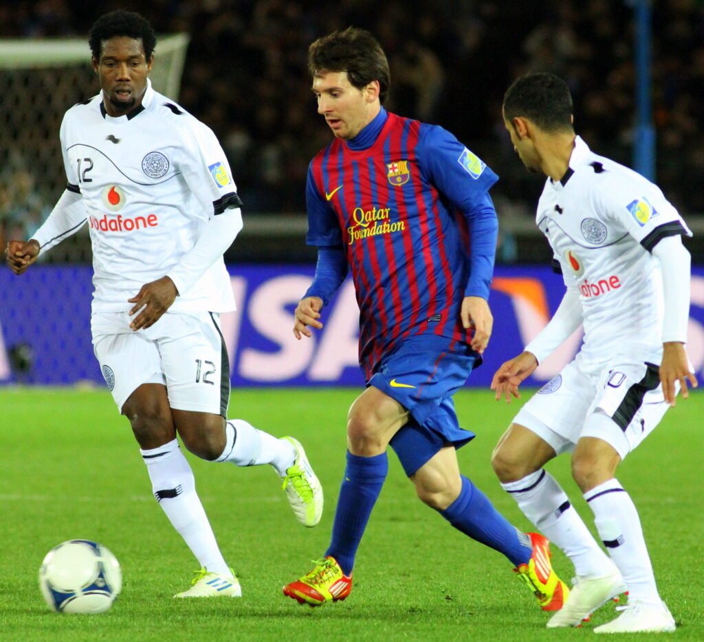 Lionel Messi celebrating with teammates