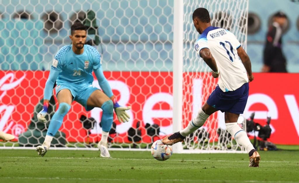  Marcus Rashford kick the football into football net